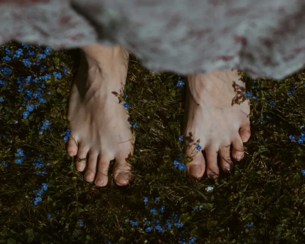 Barefoot connection to the Earth for earthing and grounding, aligning the Hara with the Schumann Resonance in a return to Homecoming